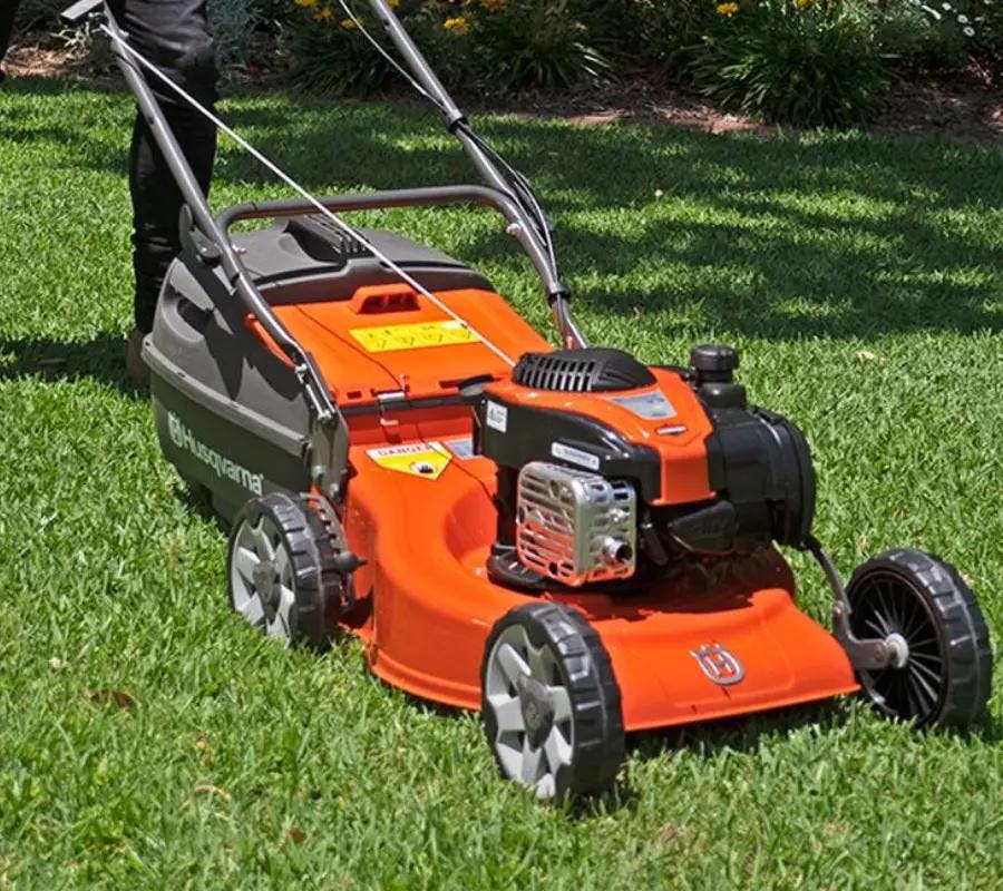 husqvarna lawnmowers on green grass